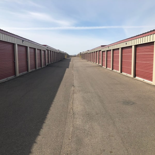 Red doors on outdoor units at StorQuest Self Storage in Williston, North Dakota