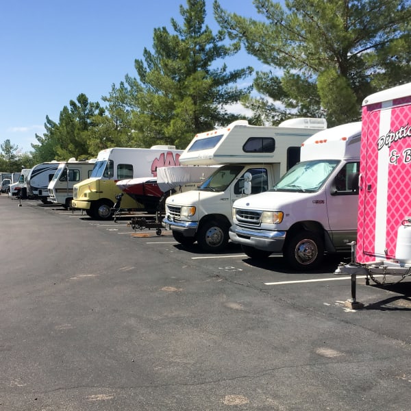 RVs, boats, and trailers parked at StorQuest Self Storage in Tempe, Arizona