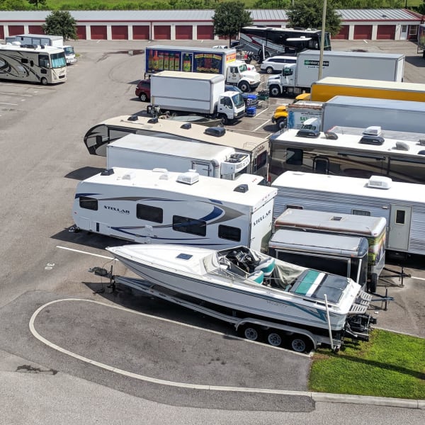 RVs, boats, trucks, and trailers parked at StorQuest Self Storage in Tucson, Arizona