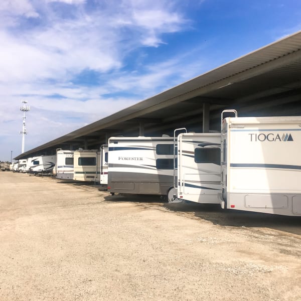 Covered RV, boat, and auto storage at StorQuest RV and Boat Storage in Moreno Valley, California