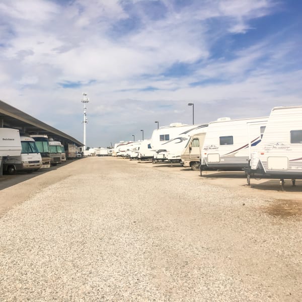 Covered and uncovered vehicle parking at StorQuest RV and Boat Storage in Moreno Valley, California