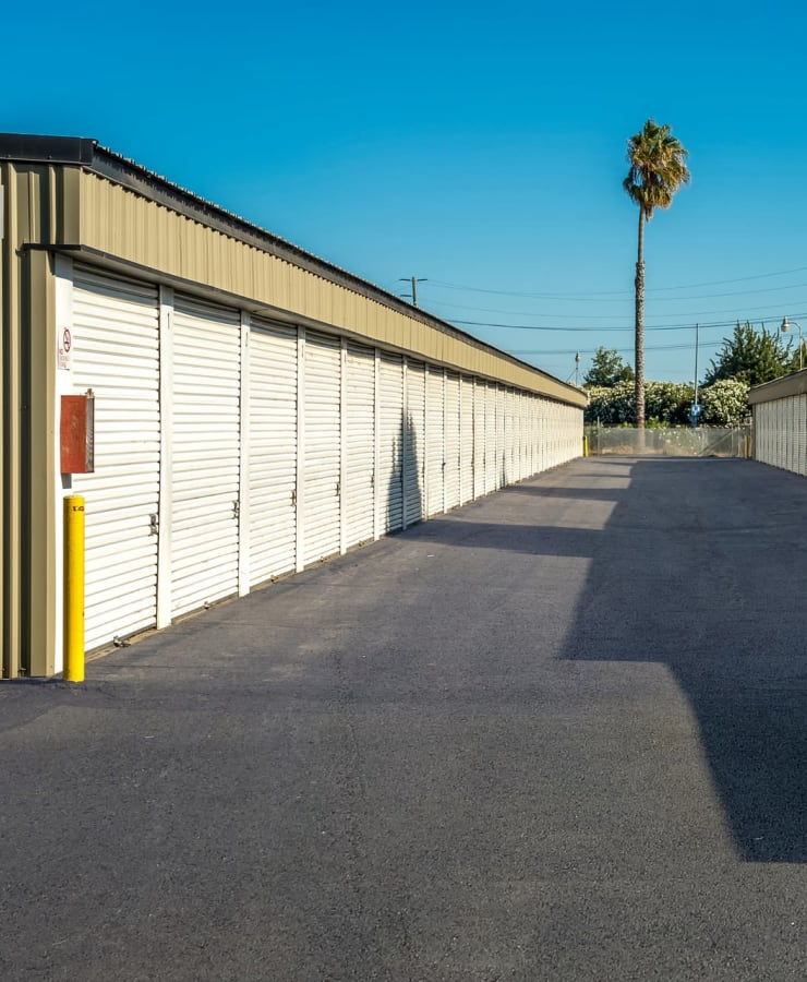Outdoor drie-up storage units at StorQuest Self Storage in Acampo, California