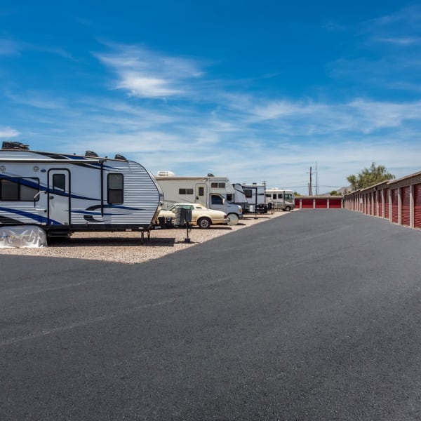 RVs parked near outdoor units at StorQuest Self Storage in Apache Junction, Arizona