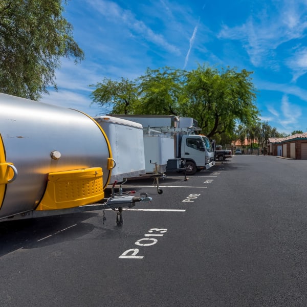 RVs, boats, trucks, and trailers parked at StorQuest Self Storage in Tempe, Arizona